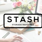 stash storage logo in black and woman using computer at desk with books and flowers in background