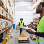 Worker checks storage in warehouse
